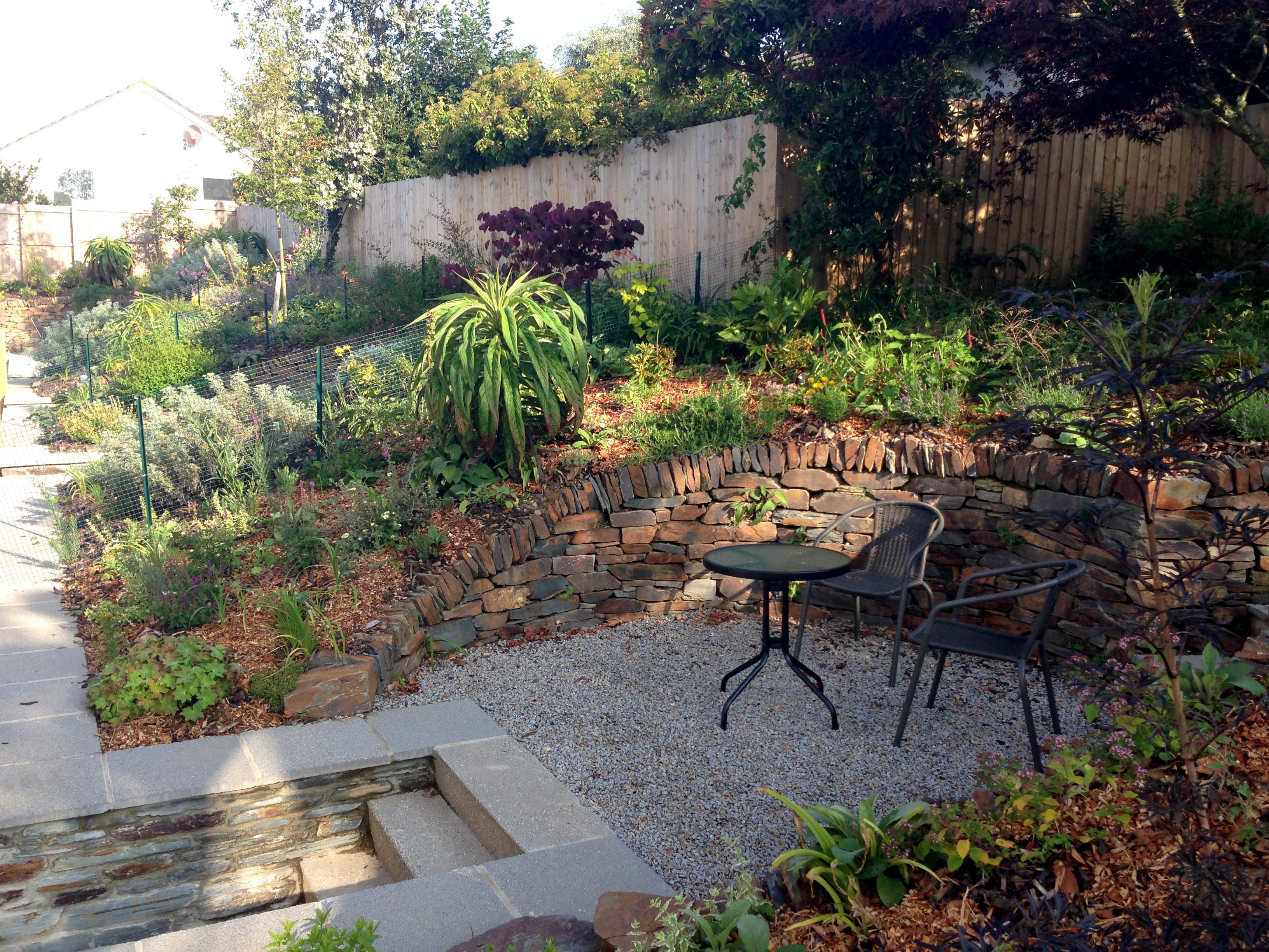 Chairs and table in the garden rear enclosure